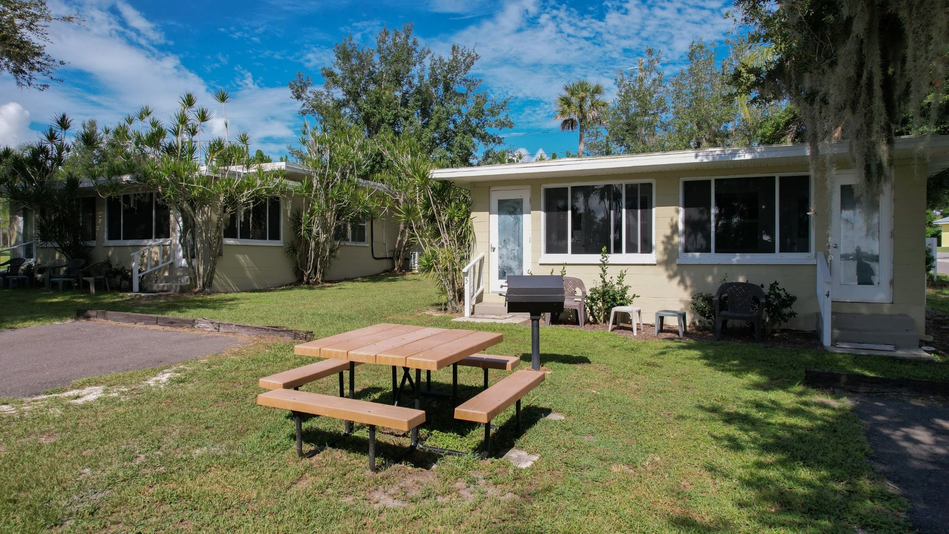 Aerial view of the duplex units beneath the trees