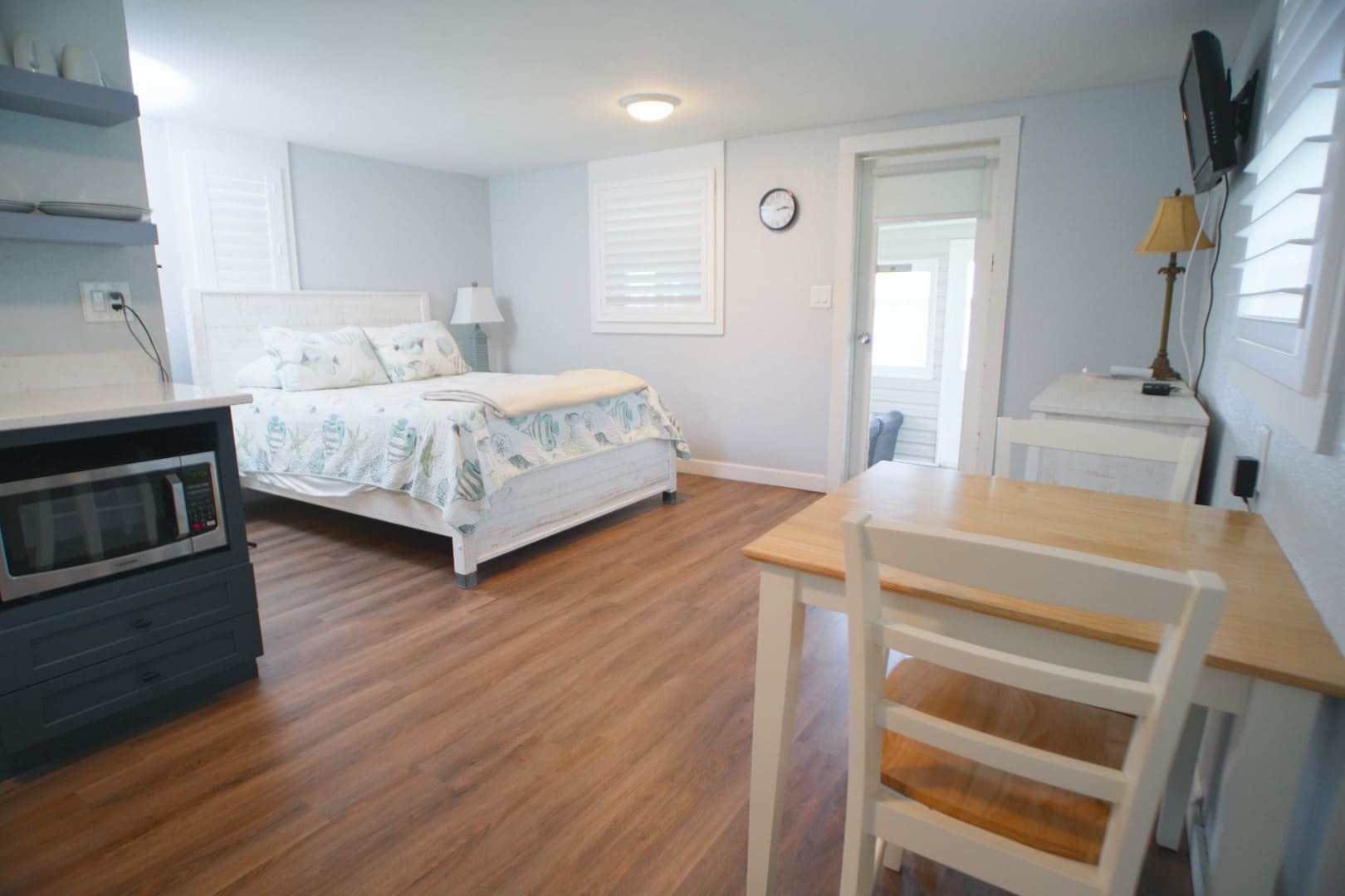 Queen bed inside a waterside cottage