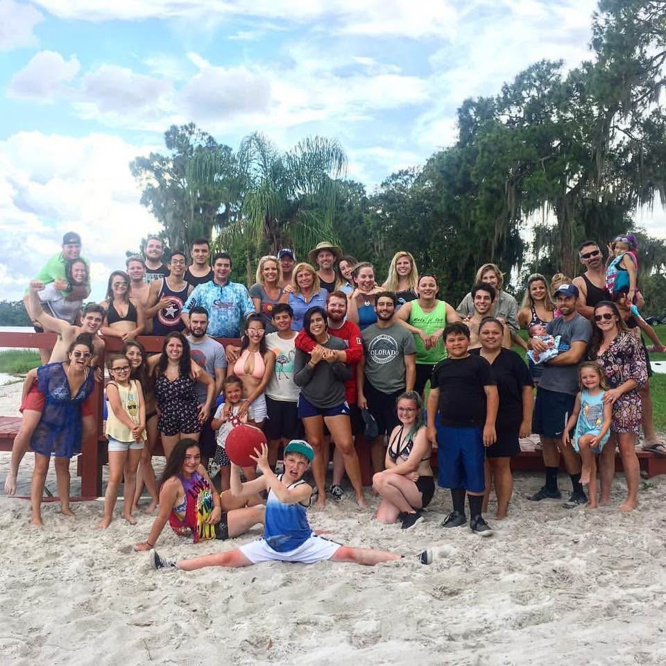 A growing group of family and friends gathered on the beach