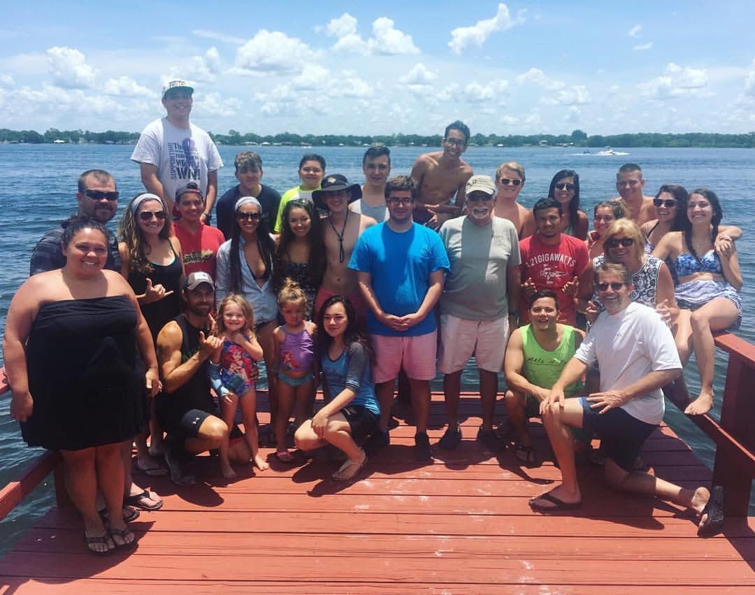 Family and friends together on the dock during an early lake trip