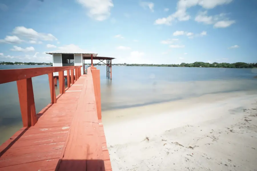 The red dock stretching out over Lake Clay